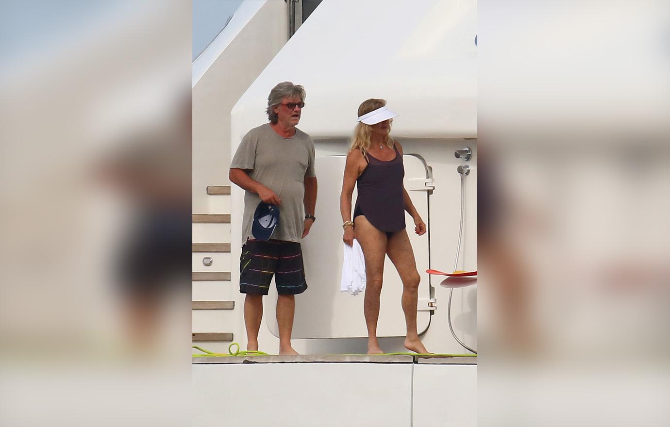 Goldie Hawn and Kurt Russell Standing on Boat