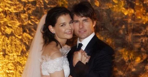 Katie Holmes, wearing a Giorgio Armani dress, posed with her then-husband Tom Cruise (wearing a Tom Ford tux) at their wedding in Italy.