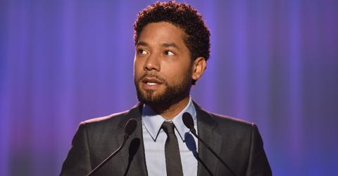 Jussie Smollet wears a gray shirt and black tie.