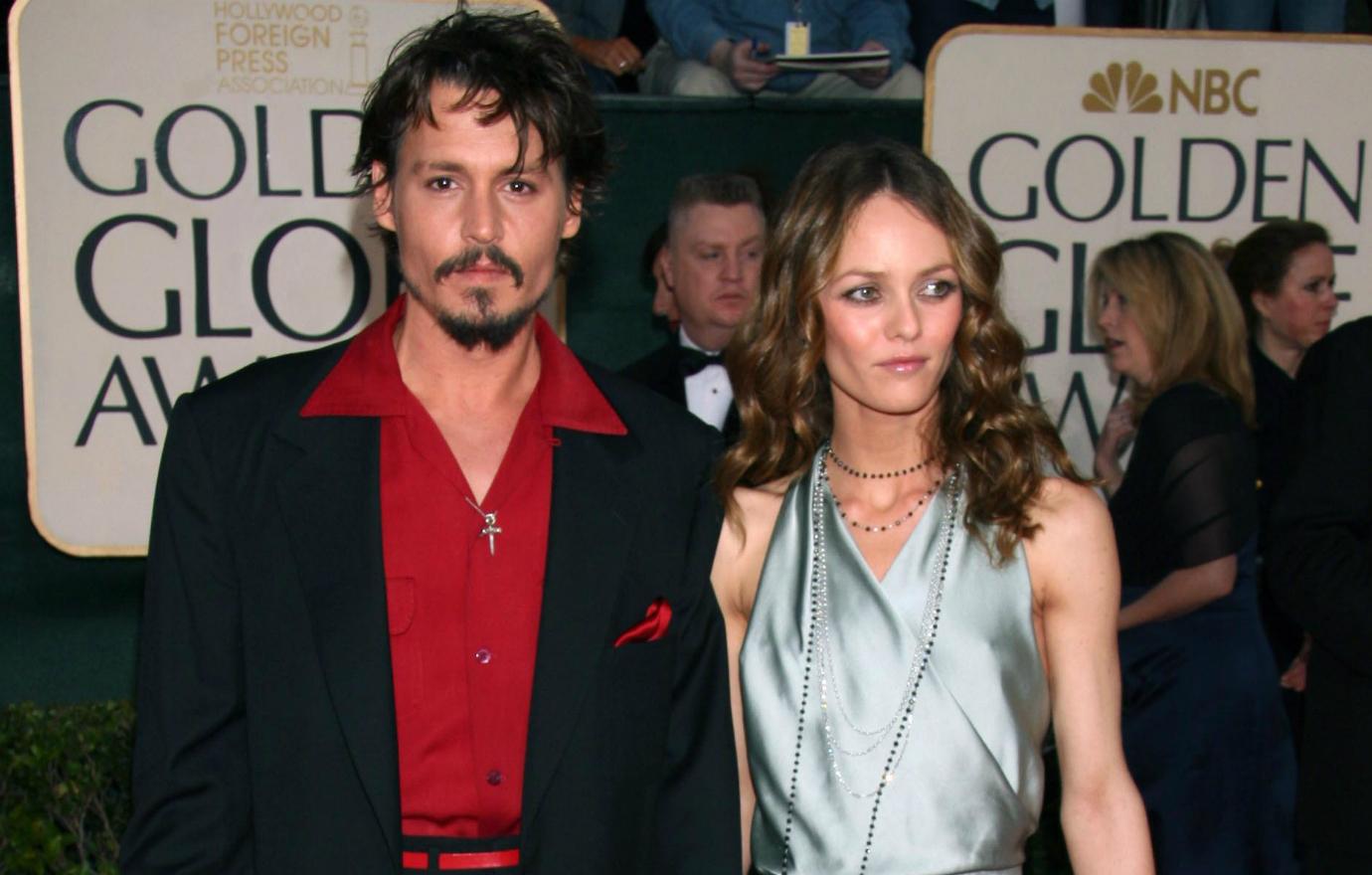 Johnny Depp, in a black suit with a white dress shirt, was joined by Vanessa Paradis, who sported a gorgeous shimmery silver sleeveless dress.