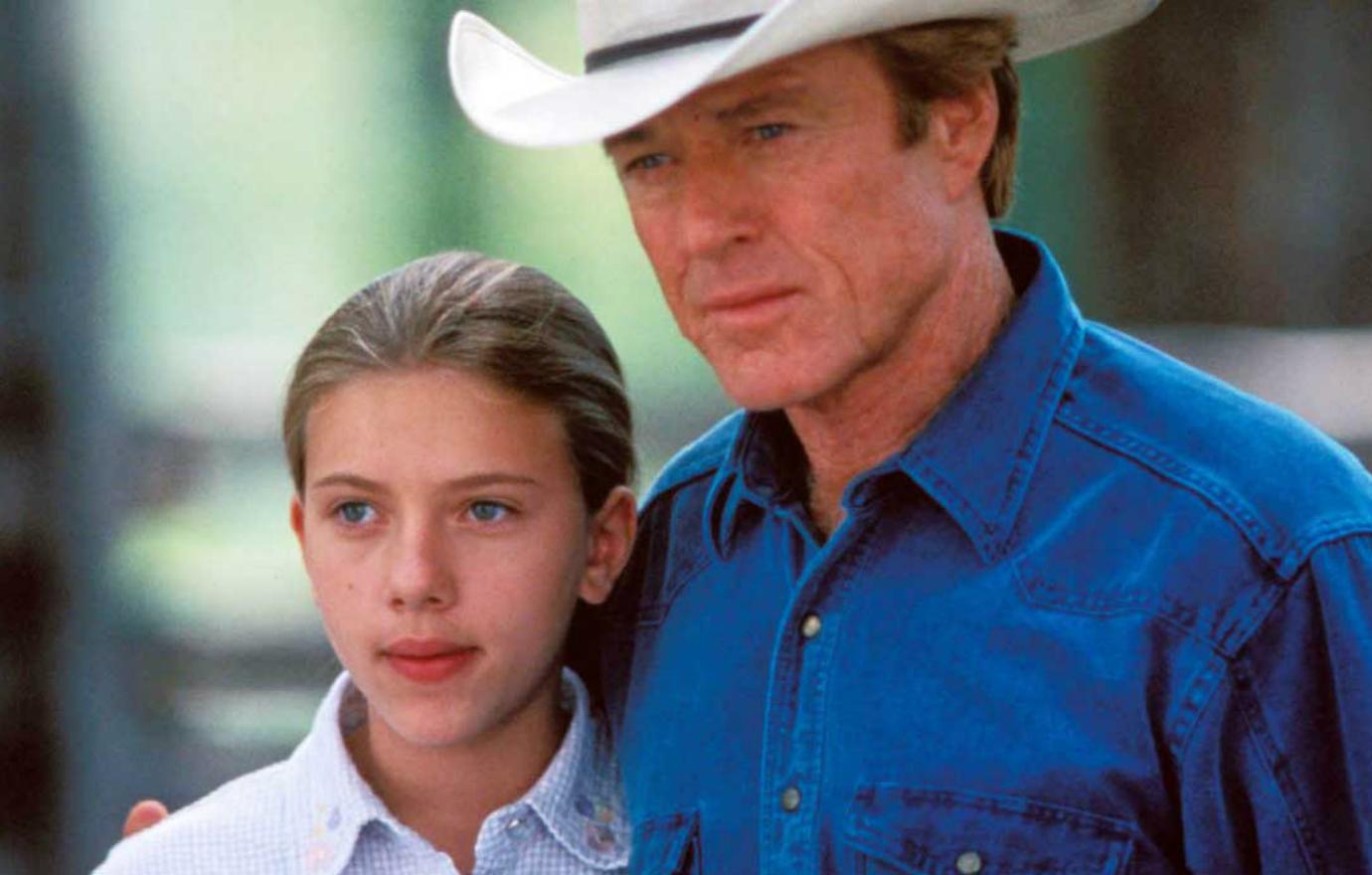 Robert Redford, who was also the film’s director, appeared in this movie still with child star Scarlett Johansson in The Horse Whisperer.