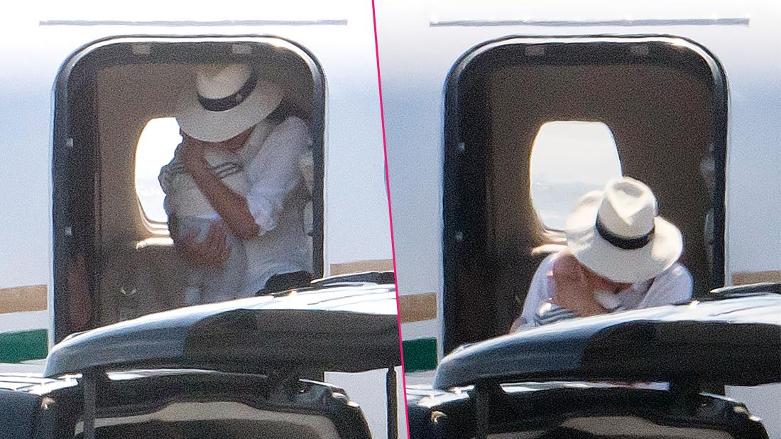 Meghan Markle cradles baby son Archie in both arms as she leaves the luxury private jet