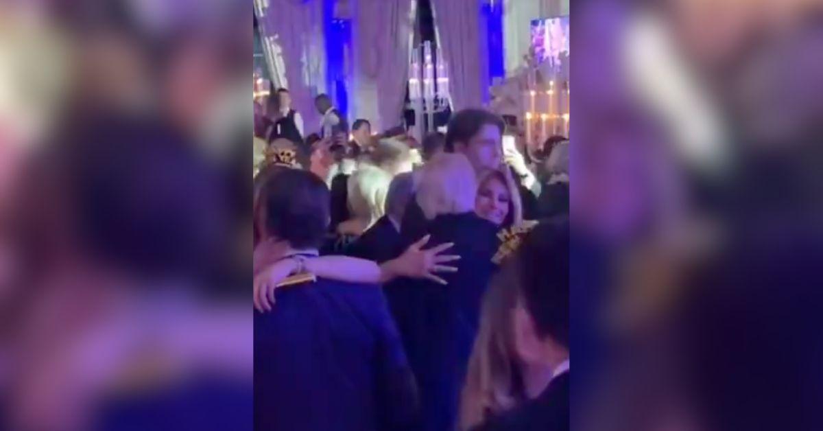 Trump and Melania Share Rare Kiss at NYE Party As Son Barron Looks On