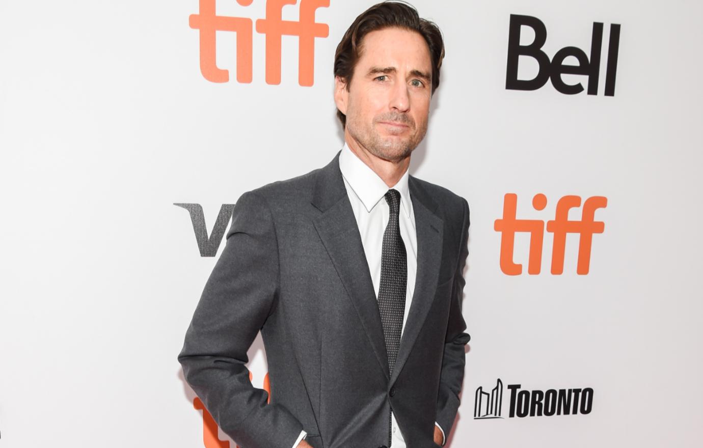 Luke Wilson made the scene at TIFF in a grey suit with a matching dark grey tie.