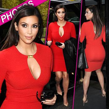 Kim Kardashian shows off abs in skintight red skirt for new pics