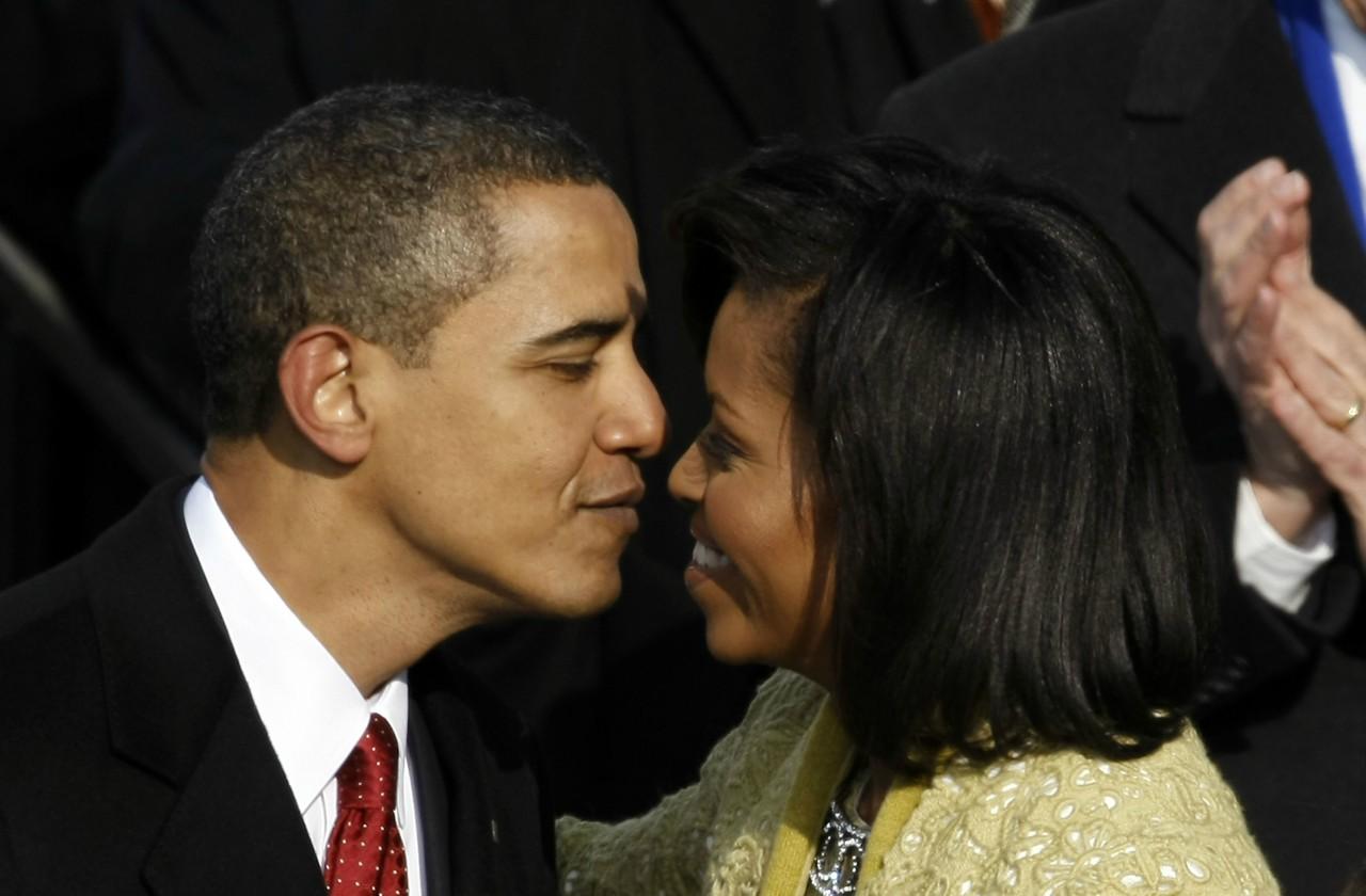 Barack and Michelle Obama go in for a kiss