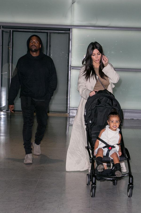 Kim Kardashian Kanye North West Photos -- Toddler Smiles As Family Arrives In Paris