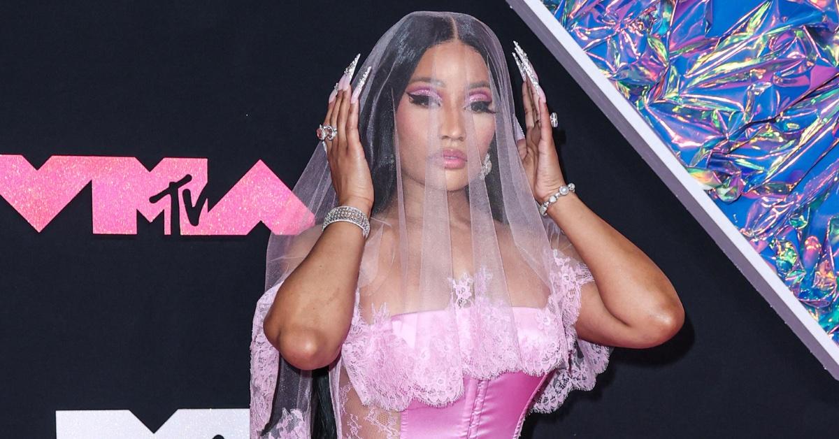 watch nicki minaj throws object back at fan video