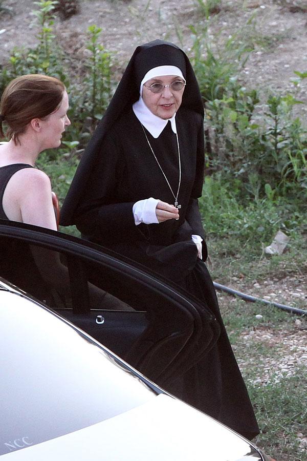 //jude law smokes cigarette dressed up as pope