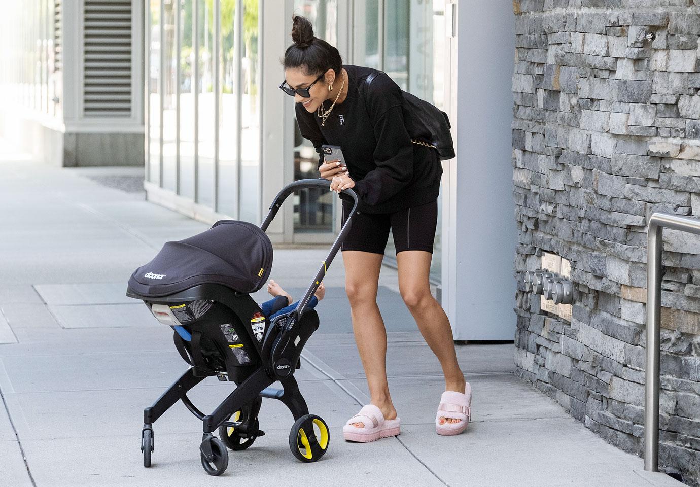 Shay Mitchell Out with her Baby and Wearing Ugg Fluffita Slide Ons