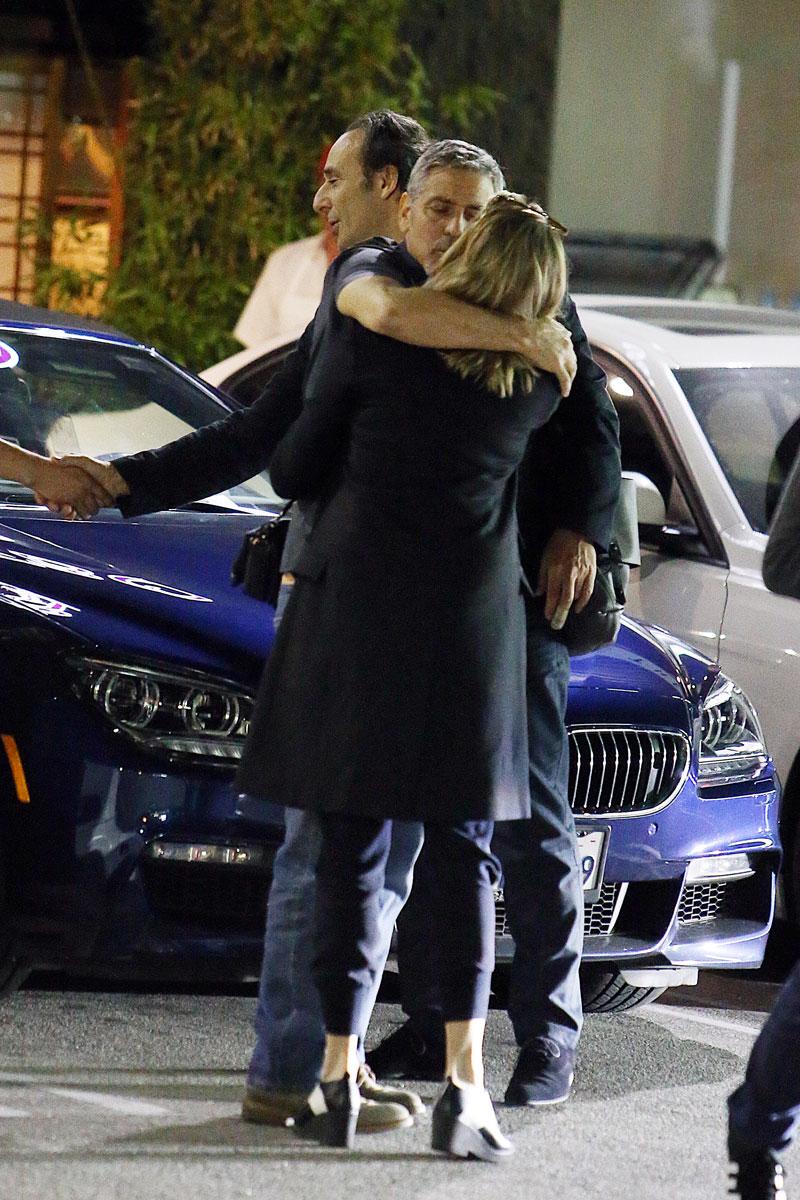 //george clooney kissing mystery woman blonde