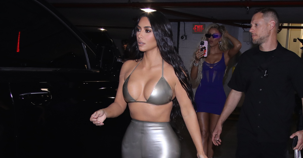 Kim Kardashian almost slips out of leather bikini top as she arrives at  SKIMS swim pop-up shop in Miami with Khloe