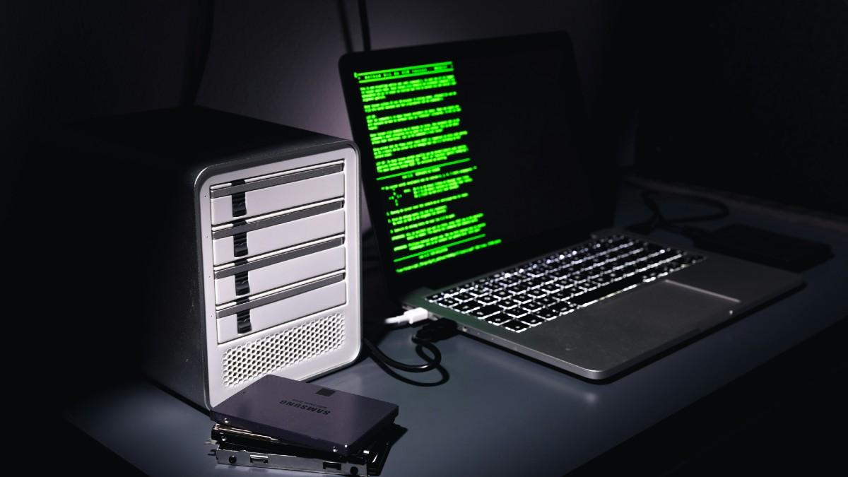 Photo of a laptop and hard drives