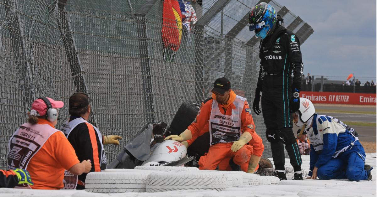 zhou guanyu flips skids  meters crash british grand prix