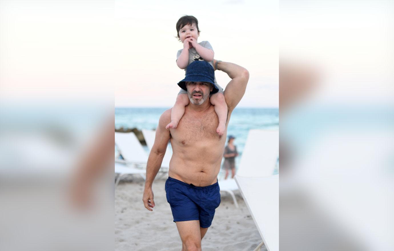 Andy Cohen Looks Buff On Beach With Baby Son