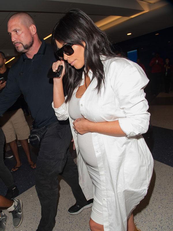 Kim Kardashian Flaunts Baby Bump In White Dress