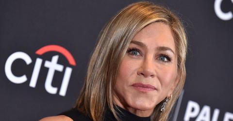 Jennifer Aniston has been pushing boyfriend Jim Curtis into the spotlight after a red carpet debut.