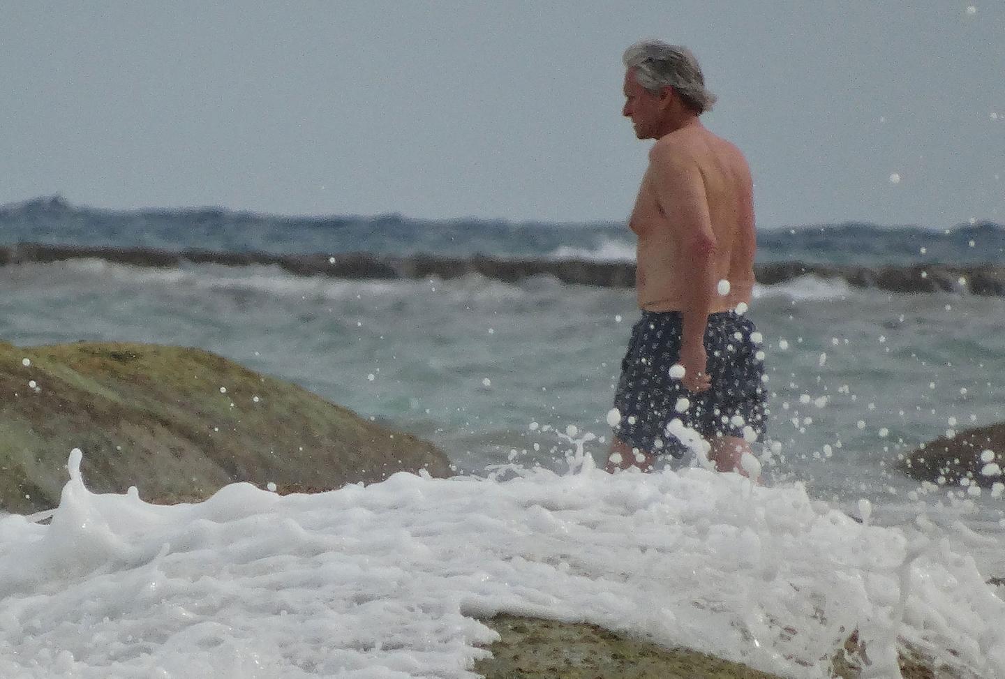 Michael Douglas Goes Shirtless On The Beach For Sad Swim