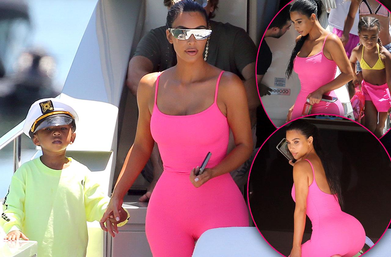 Kim Kardashian turns up the heat while modeling neon swimwear from