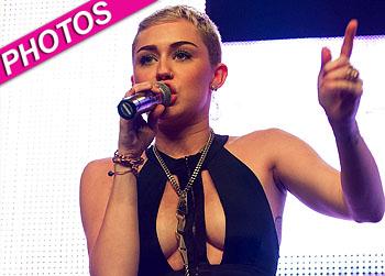//miley cyrus on stage revealing outfit post
