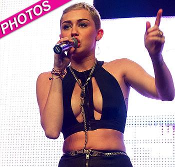 //miley cyrus on stage revealing outfit post