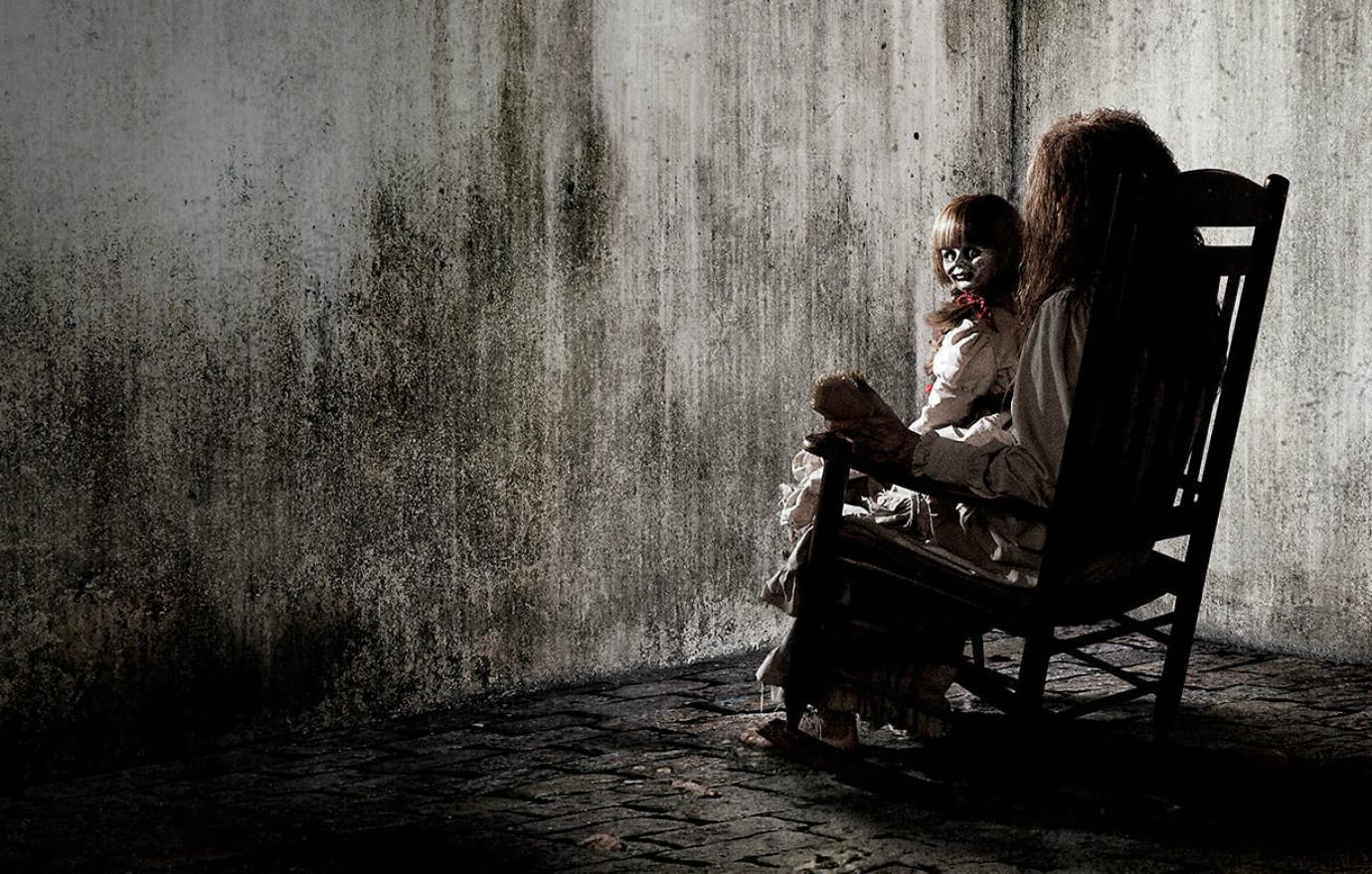 Annabelle, that haunting doll from the Conjuring movies and her own flicks, made her debut sitting on a young girl’s lap in this still from the instant classic.