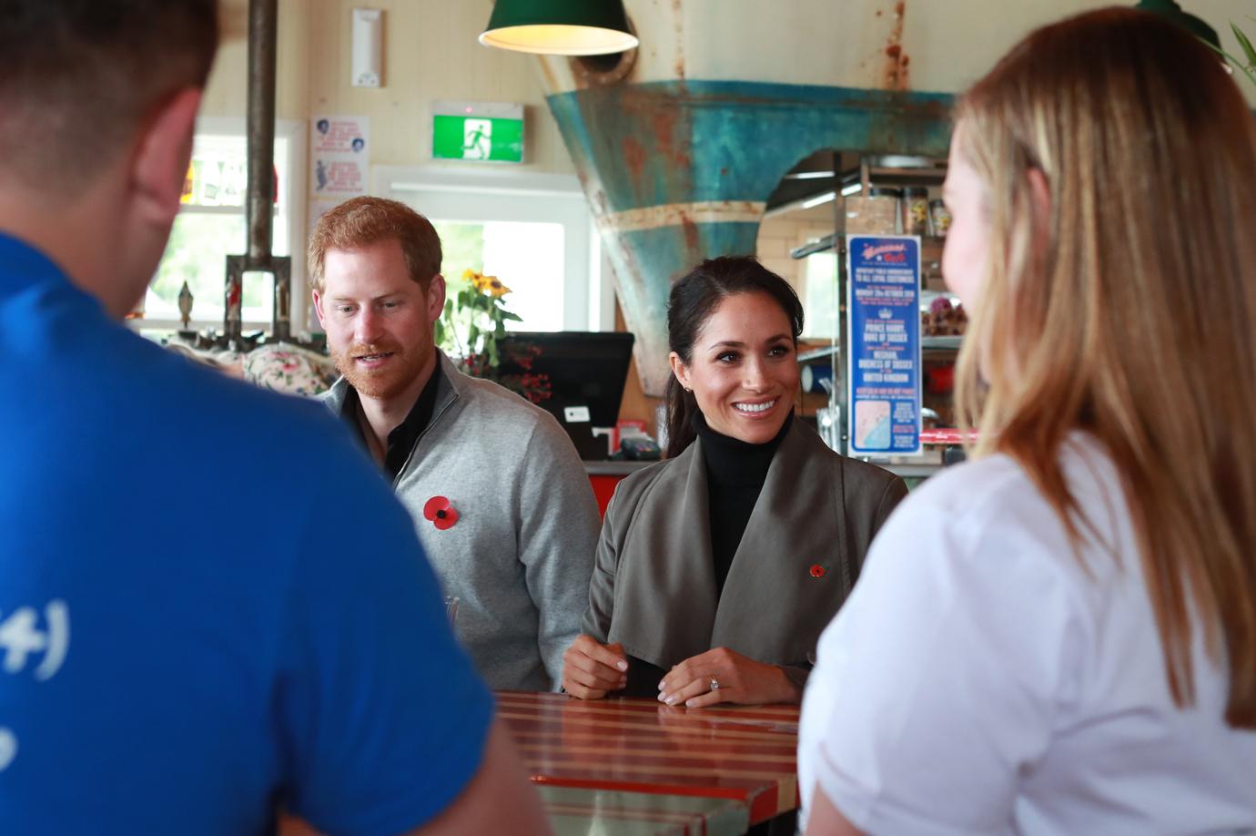 Meghan Markle Covers Baby Bump With A Coat