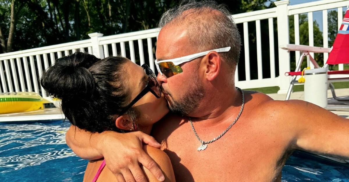 Photo of Jon Gosselin and Stephanie Lebo sharing a kiss in a pool.