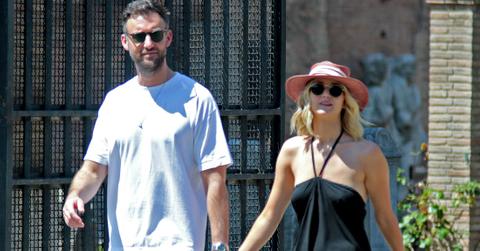 Jennifer Lawrence wore a black sundress and sun hat walking in Rome with her fiancé, Cooke Maroney, who was dressed in a T-shirt and casual slacks.