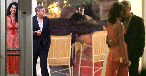 //george clooney amal clooney dinner italy kiss hold hands pp