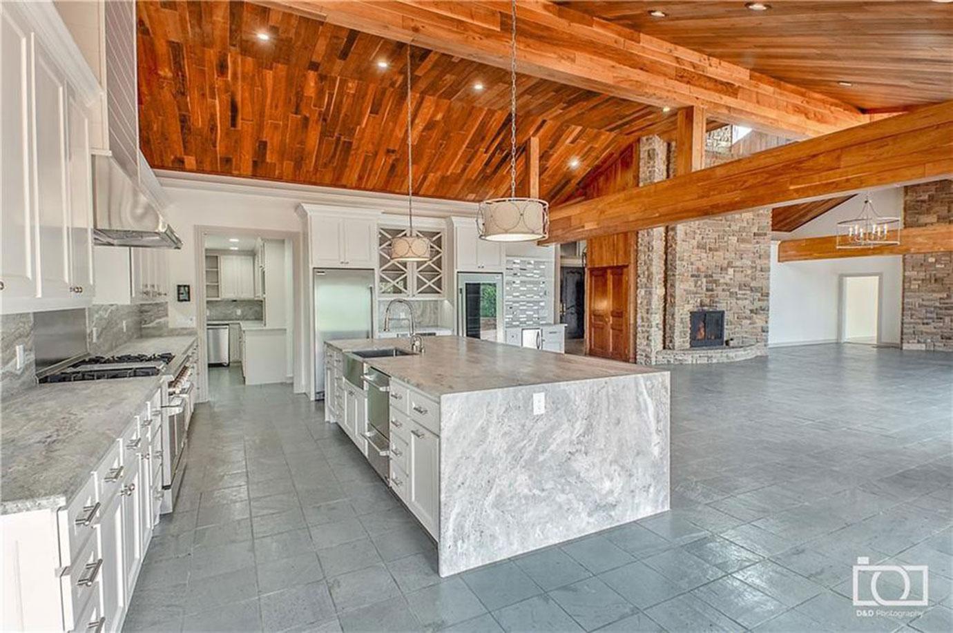 Gray And White Marble Kitchen Open To Stone Living Area