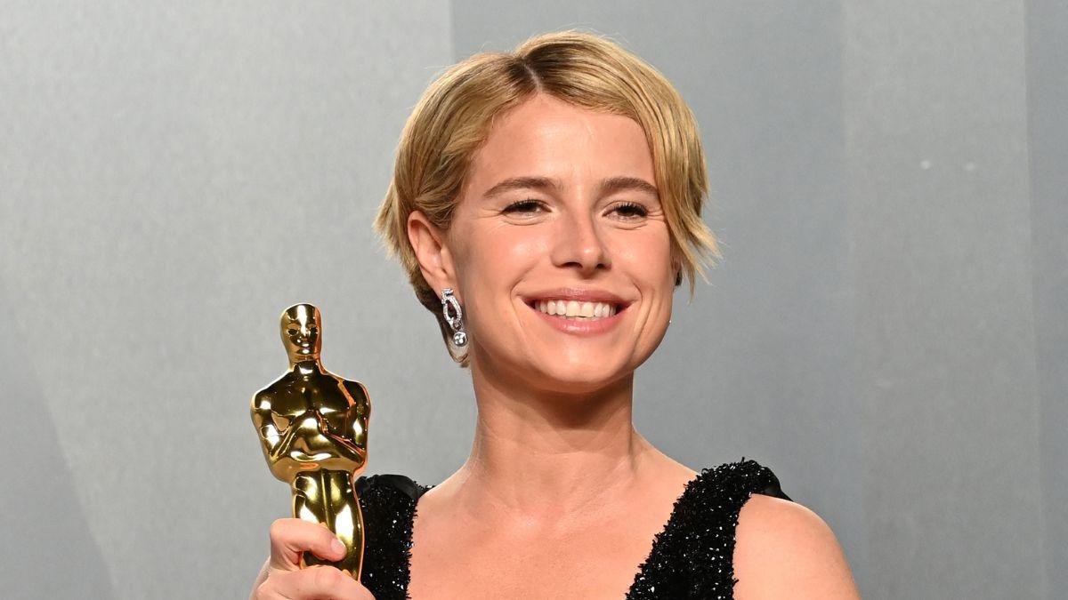 image of Jessie Buckley covered her face in shock after winning the Best Actress Oscar.
