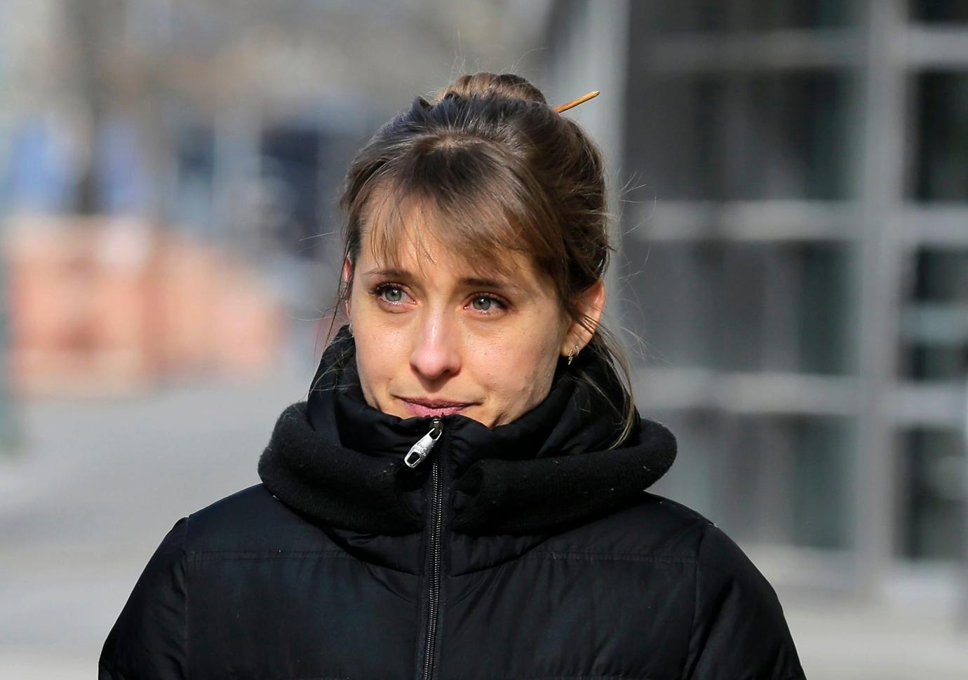 Allison Mack Smiles Outside Court Wearing High Neck Black Winter Coat