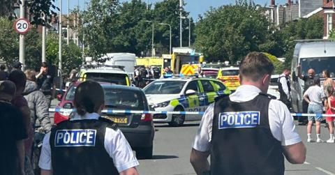 Composite photo of police at the scene of a mass stabbing in Southport, England.