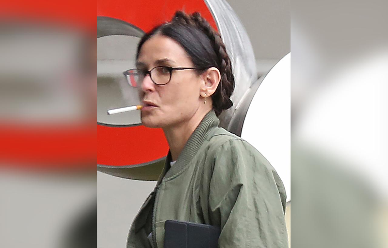 Demi Moore Puffs On Cigarette & Looks Disheveled As She Picks Pup Up