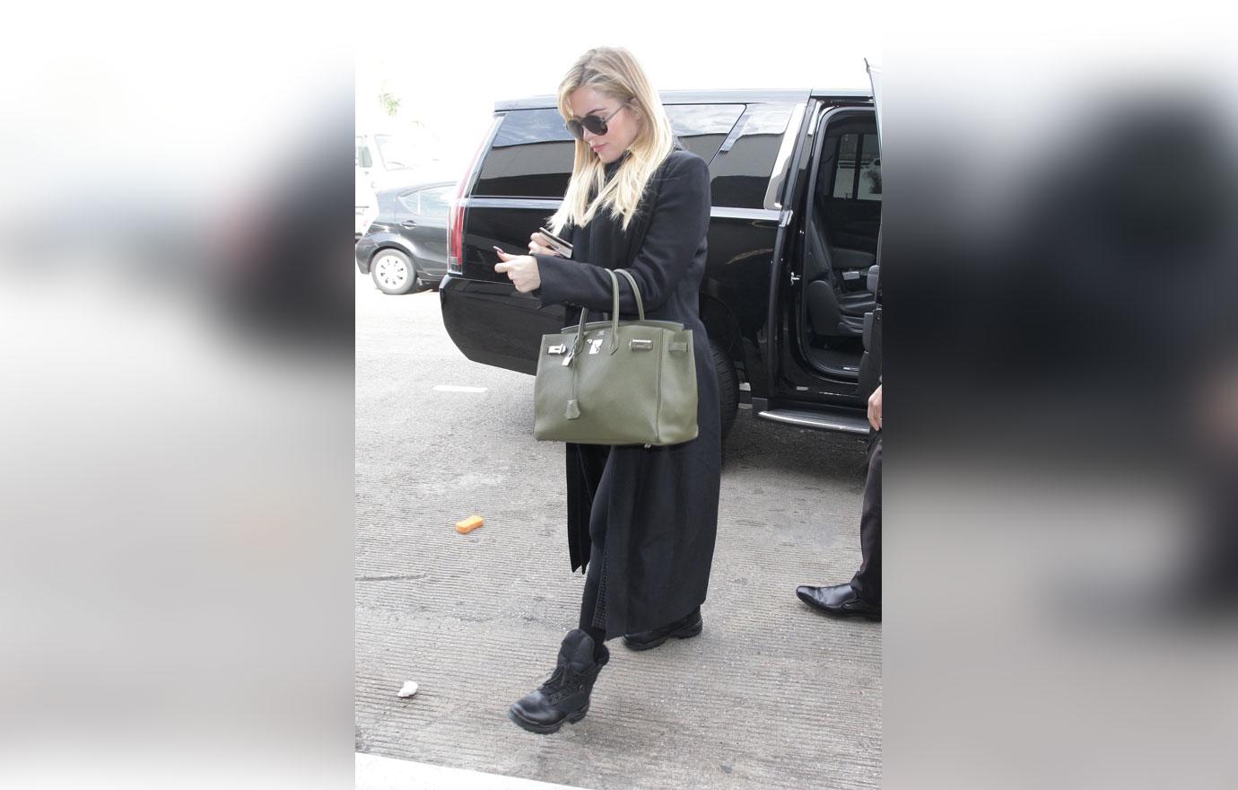 Khloe Kardashian Tries To Hide Her Growing Baby Bump in Spanx