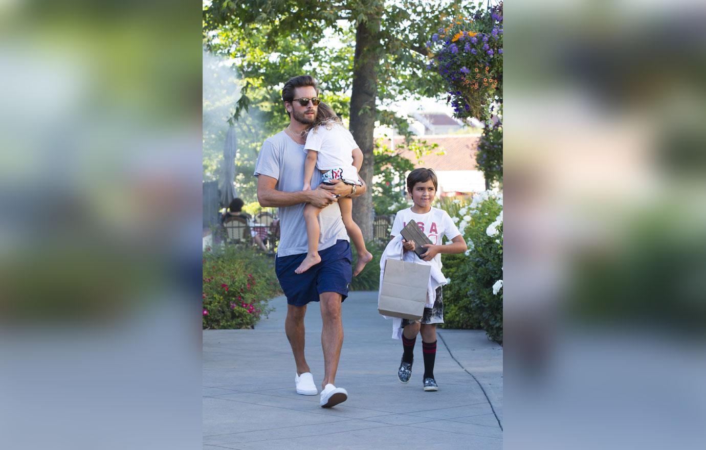 Scott disick carries sleepy penelope family dinner