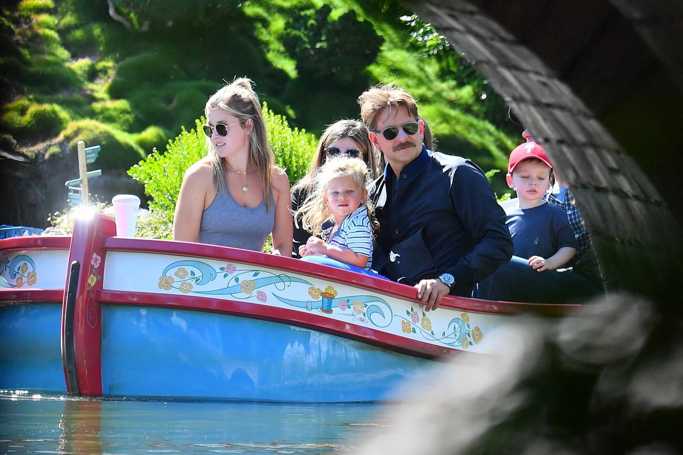 Bradley Cooper enjoys a day at Disneyland with his daughter Lea.