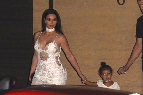 Kim Kardashian Displays Her Famous Curves In Barely-There 