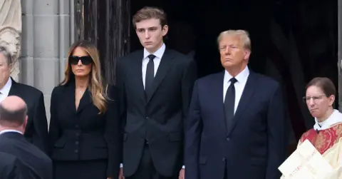 Photo of Barron, Donald and Melania Trump