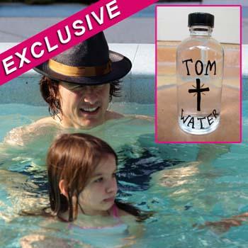 https://media.radaronline.com/brand-img/8nAaj_hVf/0x0/2012/01/tom-cruise-holy-water-auction-ebay.jpg