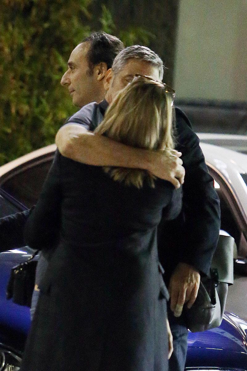 //george clooney kissing mystery woman blonde