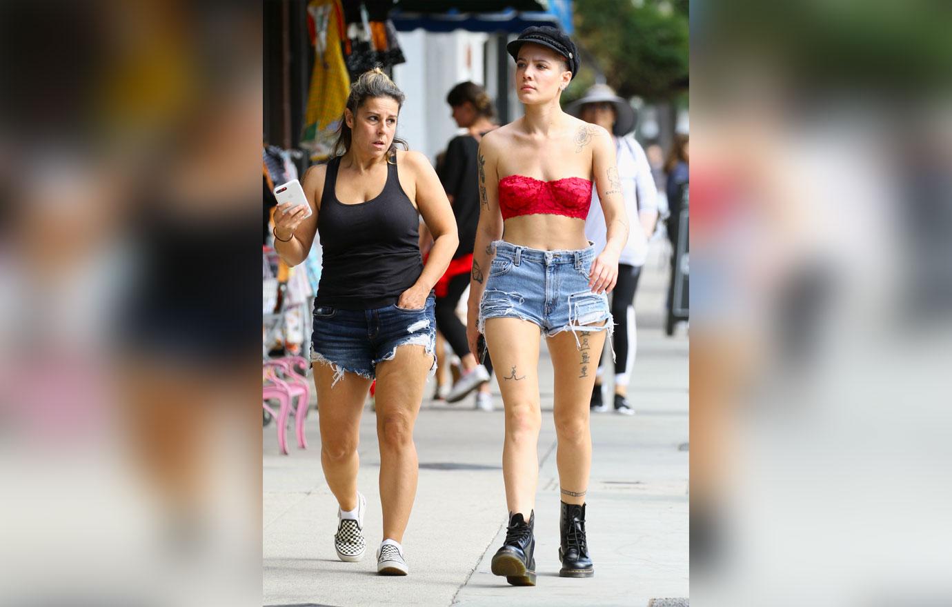 //halsey spotted wearing lace bra and daisy dukes