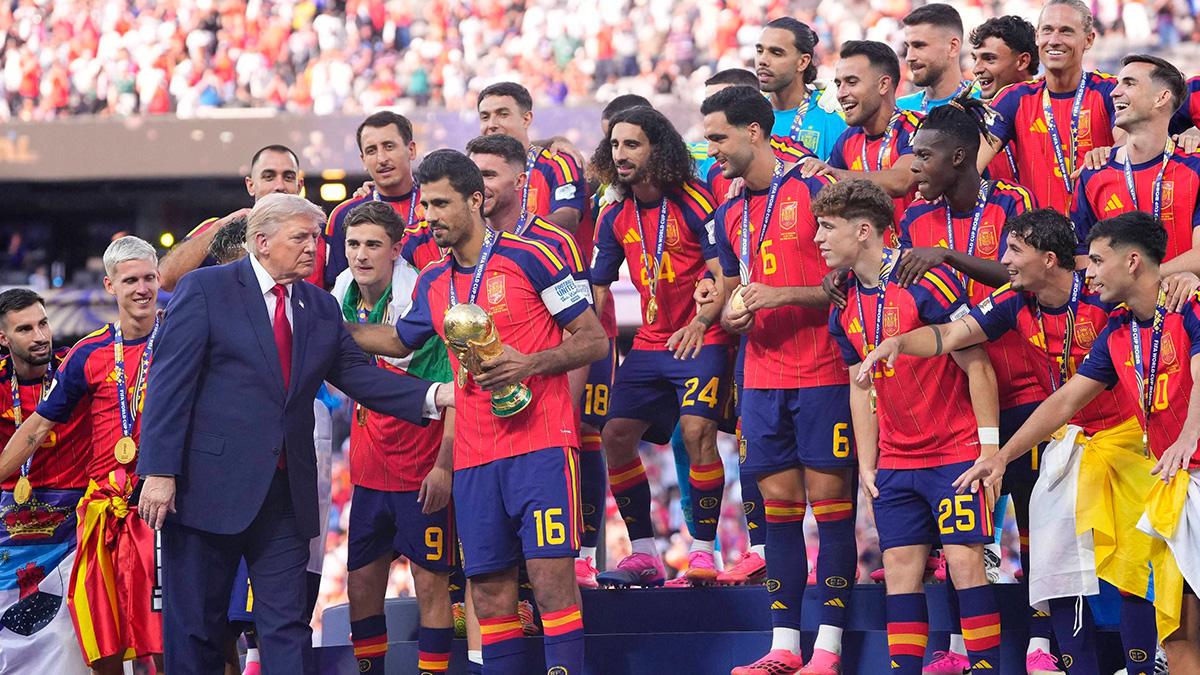 The president hopped on stage to present the team with the FIFA trophy.