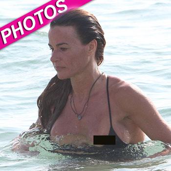 Stephanie Seymour Has A Nip-Slip In A Sexy Swimsuit On The Beach