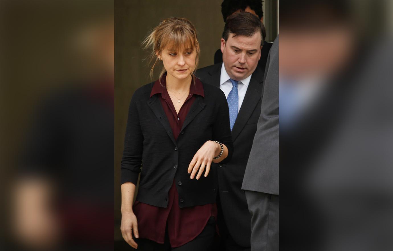 Allison Mack Looks Serious Leaving Court in Loose Burgundy Top With Black Cardigan Alongside Lawyer