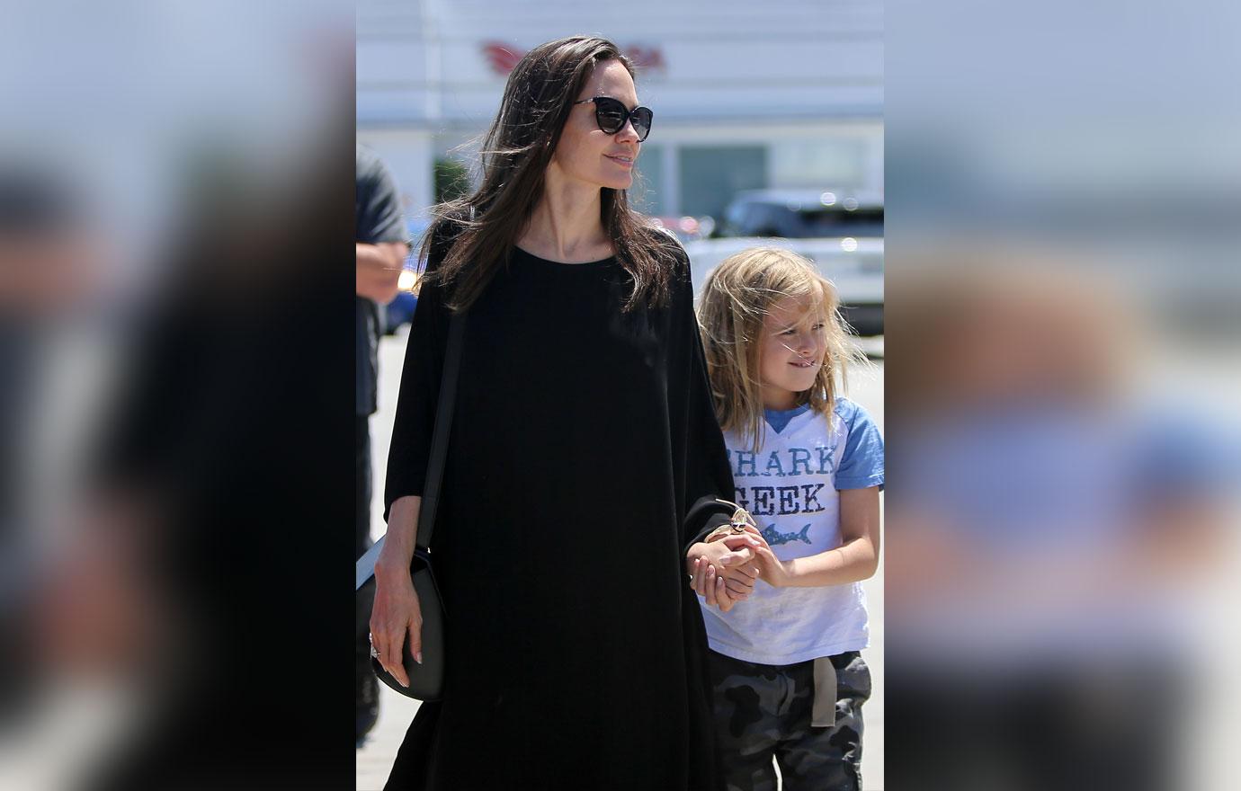 brad pitt angelina jolie daughter vivienne child abuse claims custody battle