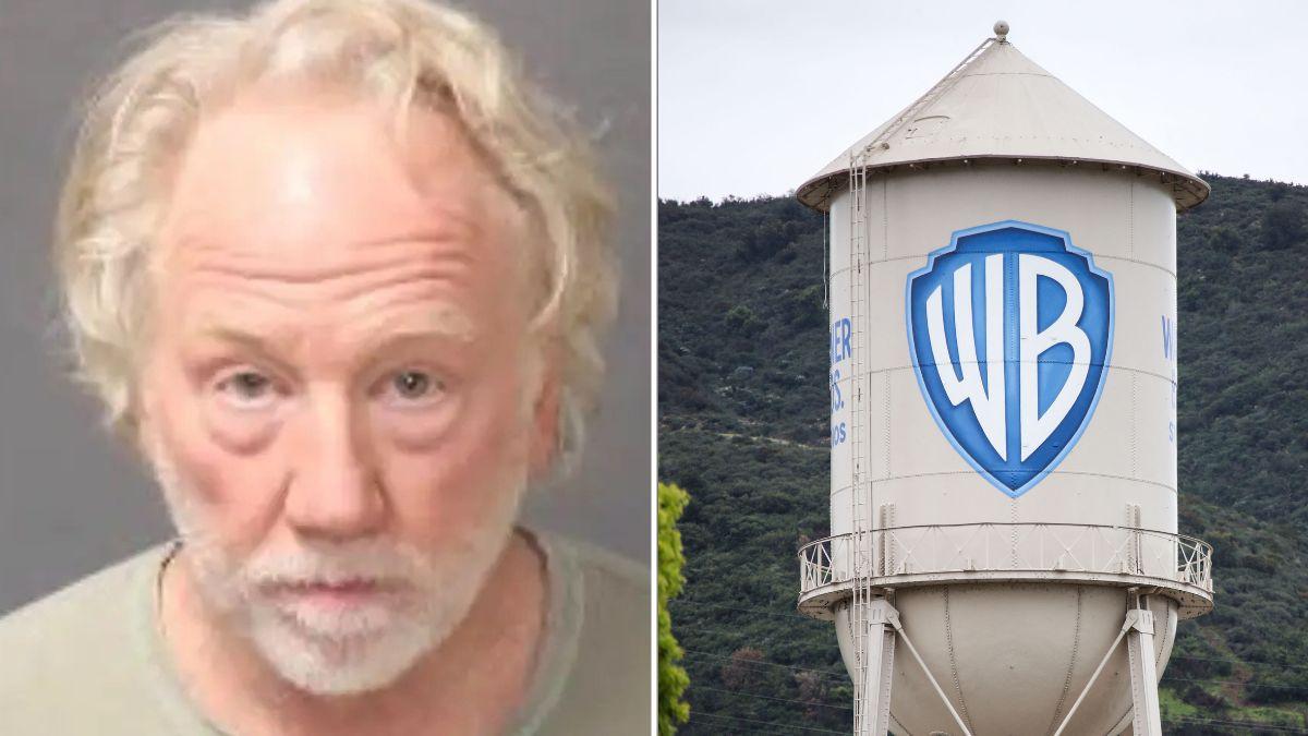 A photo of Timothy Busfield alongside the Warner Bros. logo on a water tower
