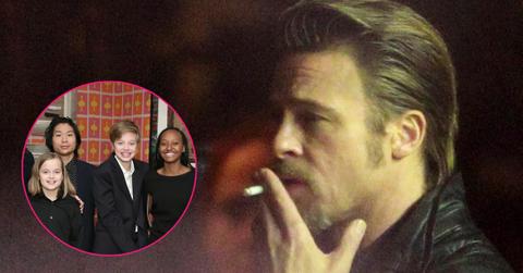 Brad pitt smokes a cigarette. Inset to the left, a group photo of his kids