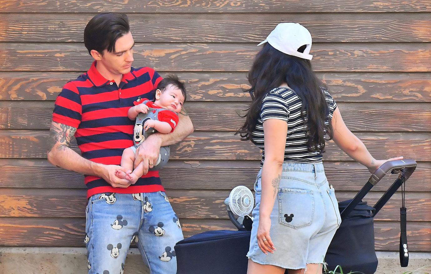 drake bell holds baby disneyland first public appearance photos pleads guilty child endangerment